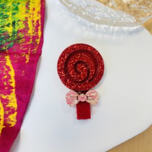 Sucette rouge et dorée